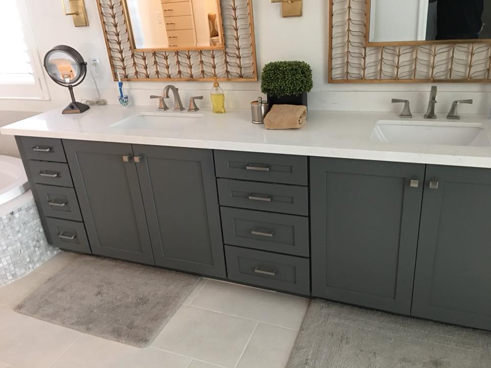Tile flooring and tub surround with dark-cabinet vanity